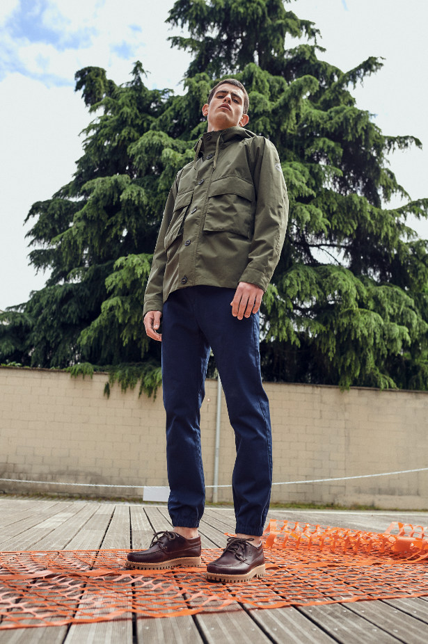 man-wearing-khaki-jacket-navy-chinos-brown-timberlands-boat-shoes