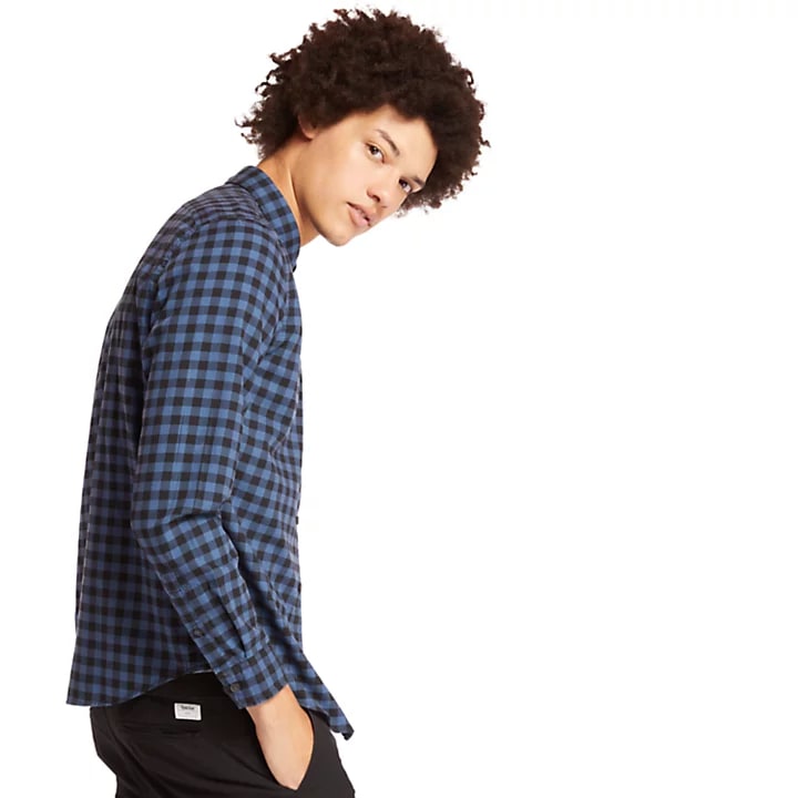 model-wearing- blue-and-black-check-shirt