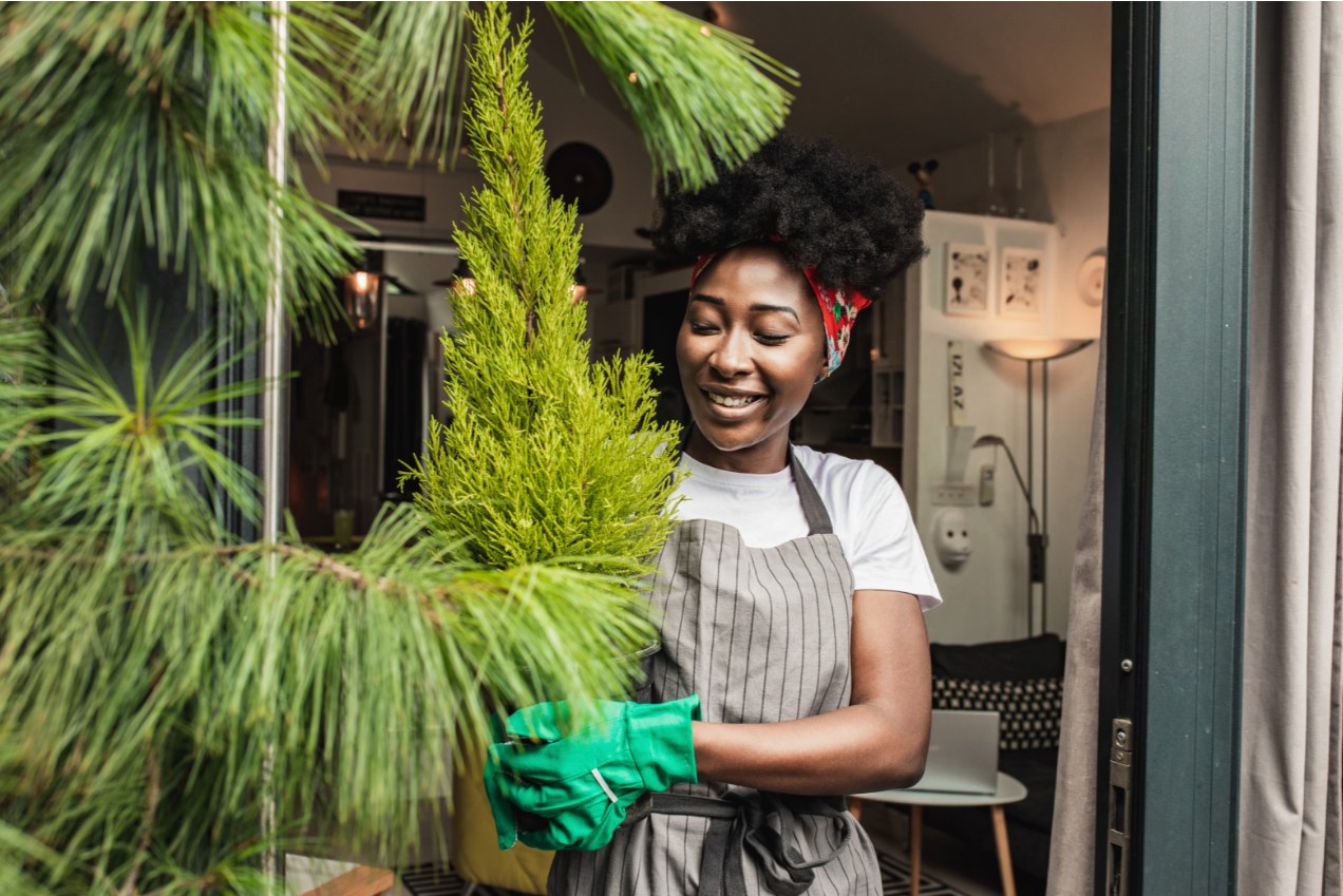 woman-smiling-with-gardening-gloves