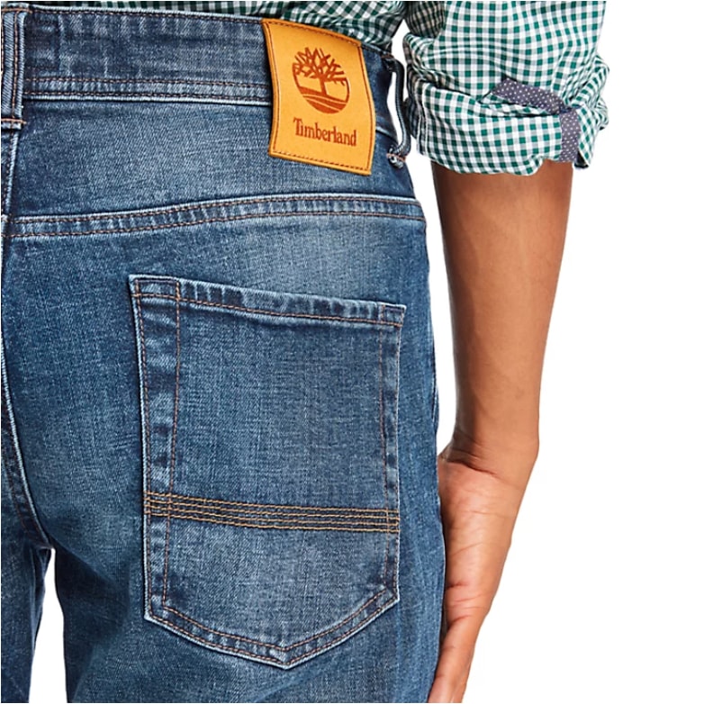 Blue jeans view from back with green check shirt