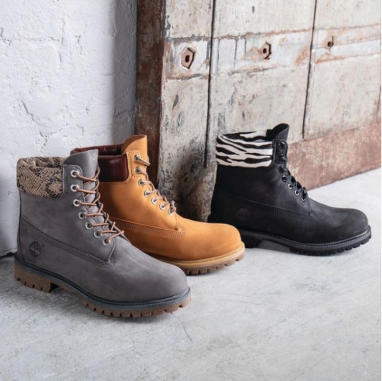 Chukka boots in different colours against wall