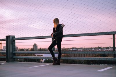Woman looking at sunset on rooftop