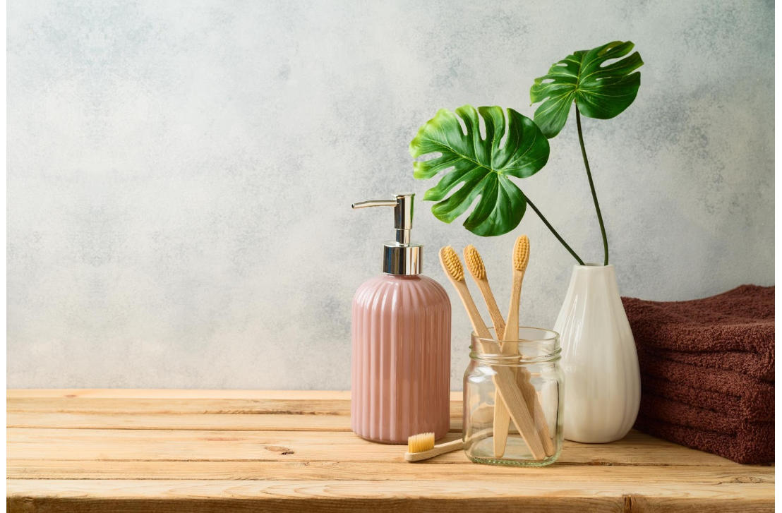 Bamboo toothbrush with plants and towel
