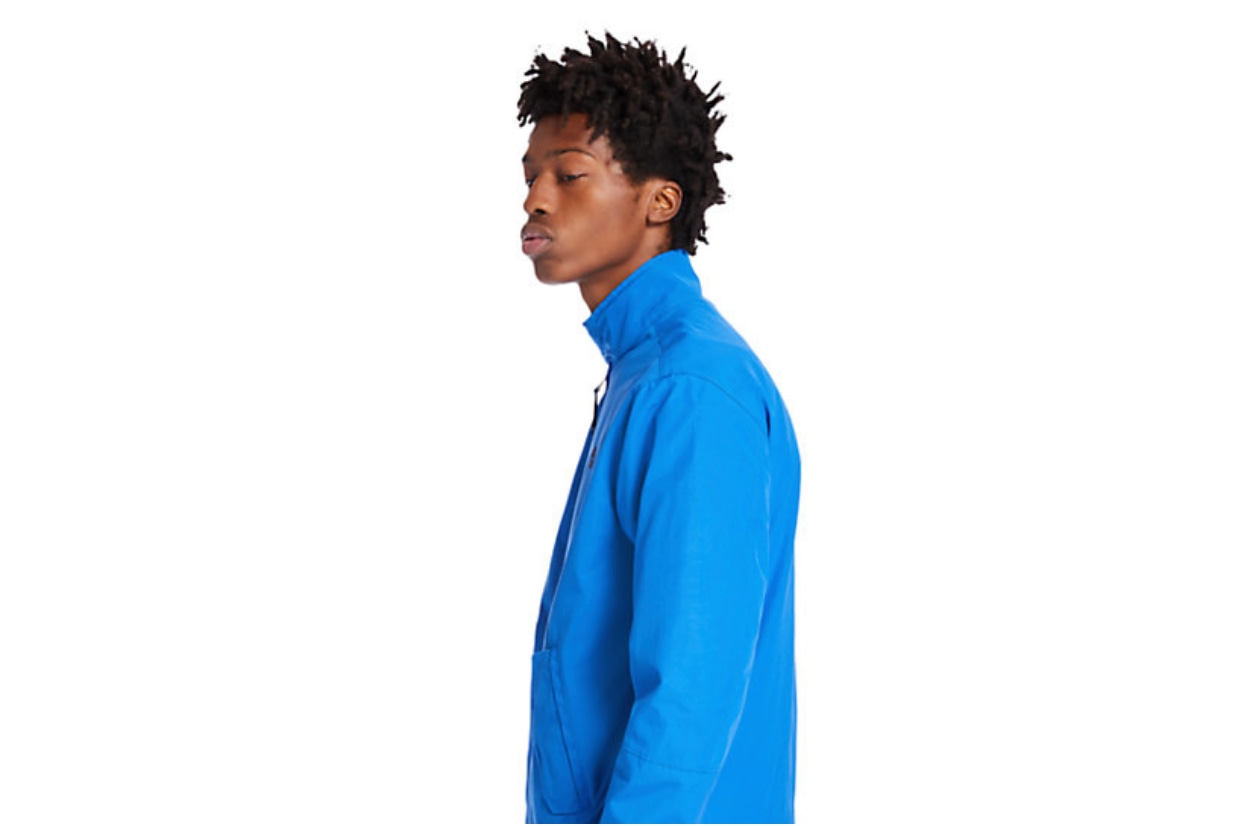 Model wearing blue bomber jacket