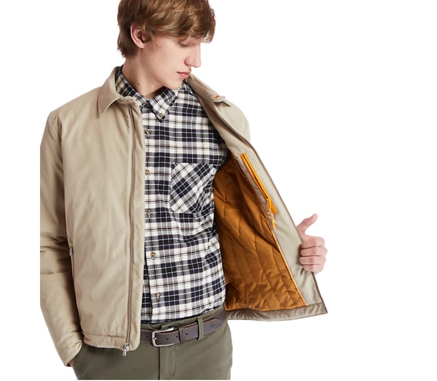 Model wearing beige bomber jacket