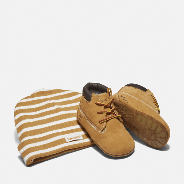 Lot chaussons chukka et bonnet pour bebe en jaune