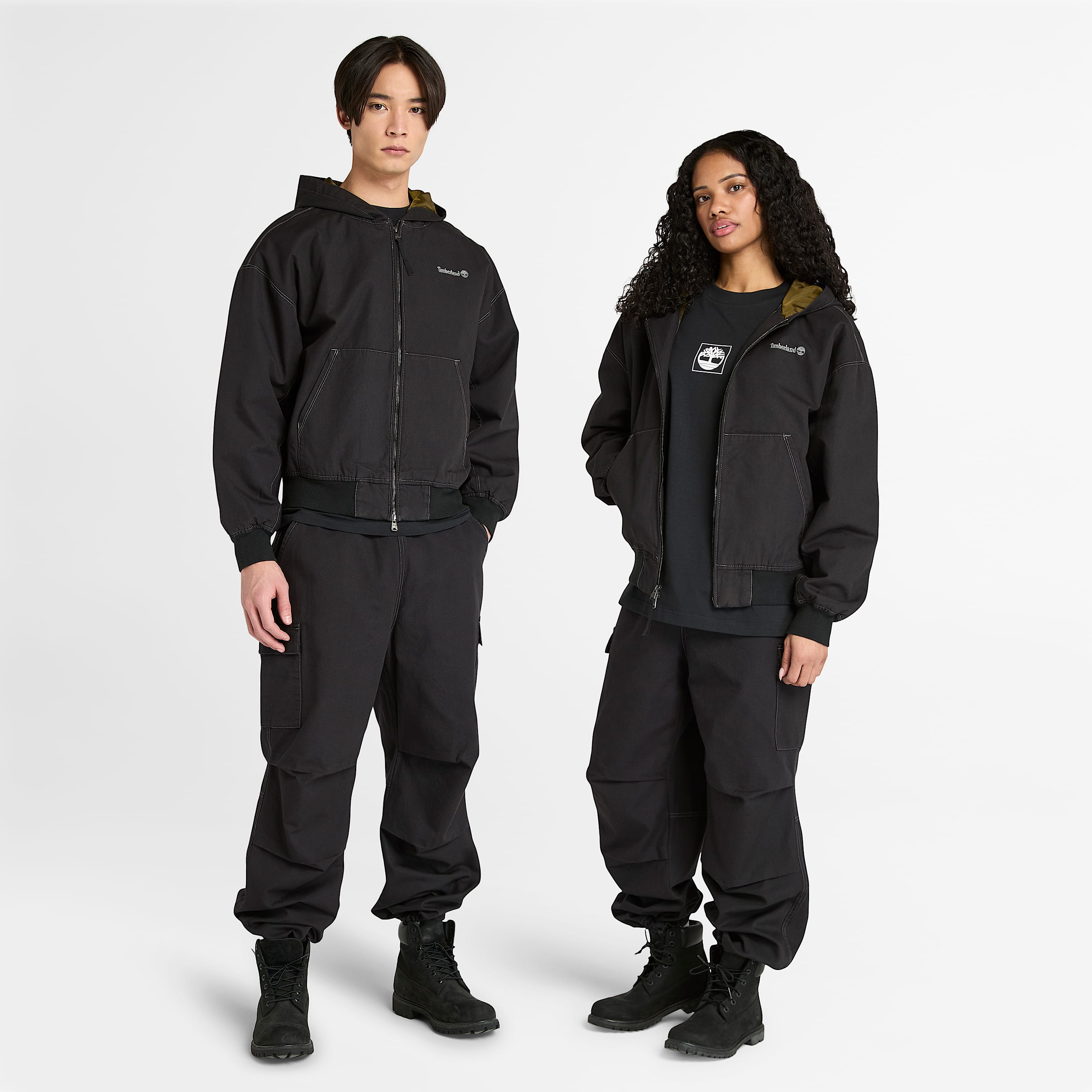 All Gender Bomberjacke aus gewaschenem DuckCanvas mit Kapuze in Schwarz TBL Schwarz HERO