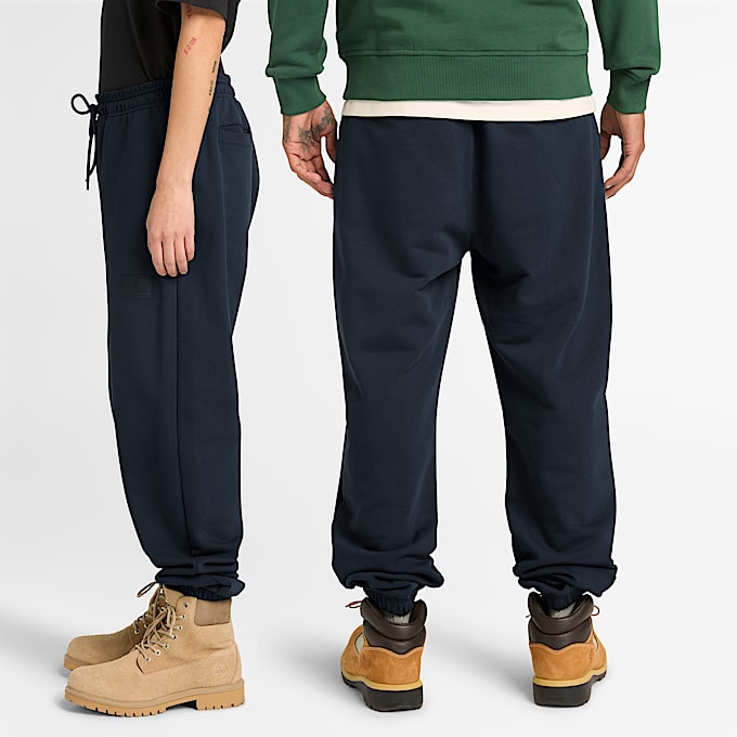 Pantalón de chándal con insignia de silicona unisex en azul oscuro