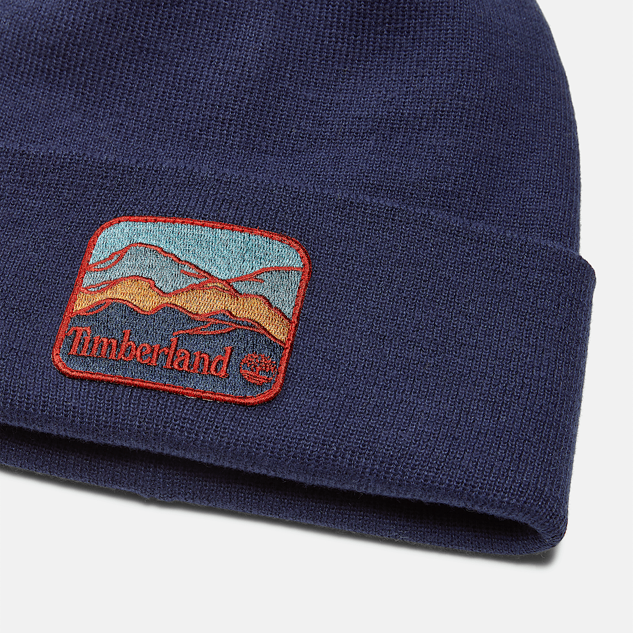 Bonnet a ecusson montagne pour homme en bleu fonce